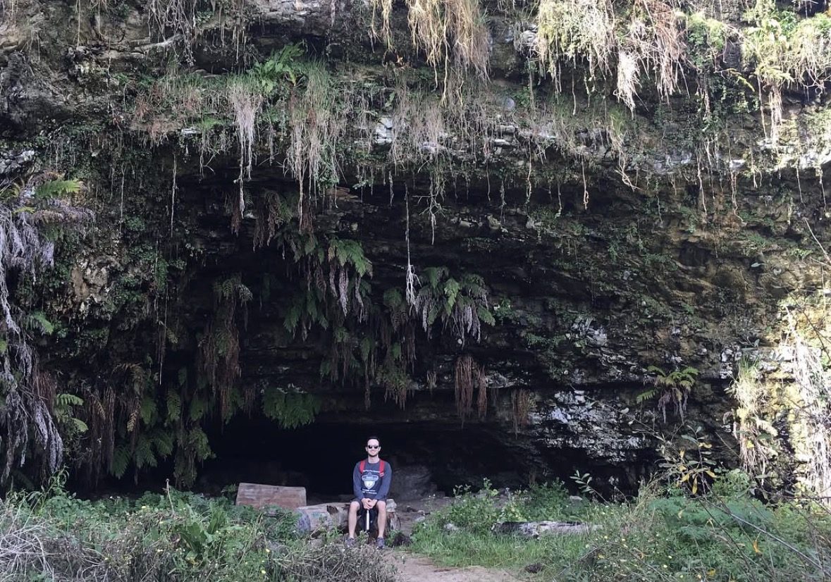 Visitor in comfortable clothing and walking shoes on the nature trail near Fern Grotto, Kauai